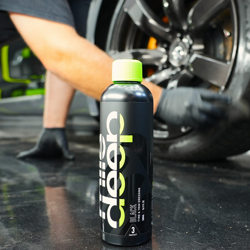 Black tyre & trim dressing in front of a black tyre