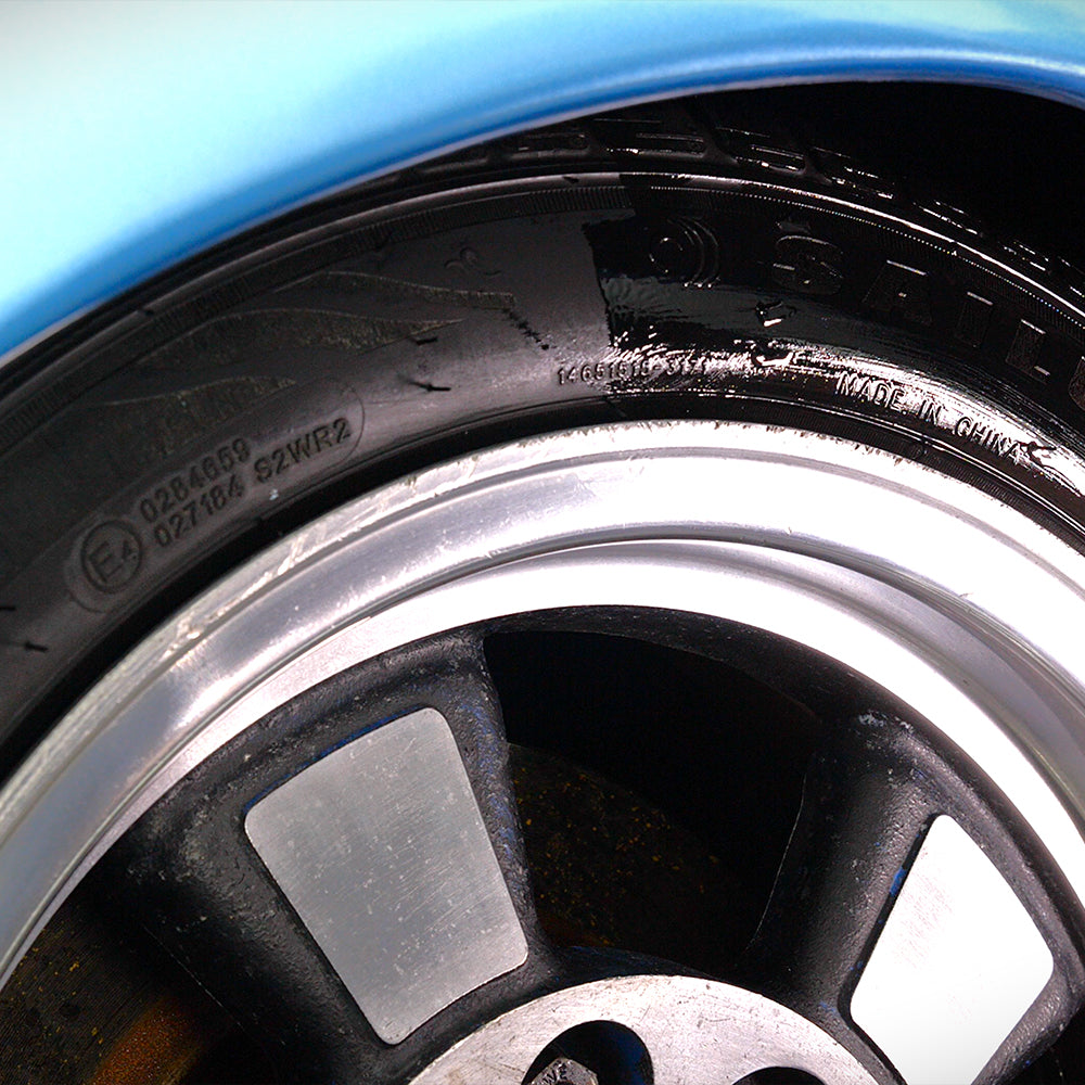 Black tyre & trim dressing shown on black tyre