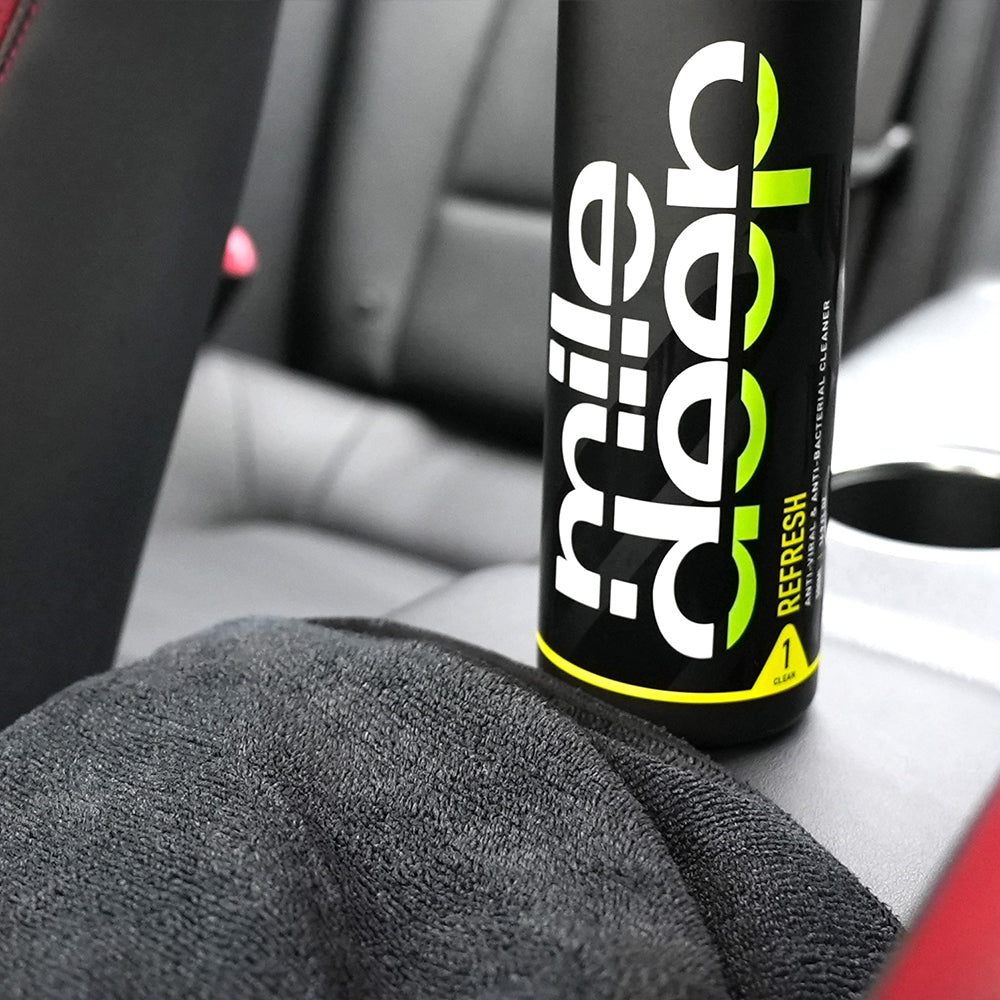 enact 300 gsm car microfibre cloth next to Refresh anti-viral & anti-bacterial cleaner car spray